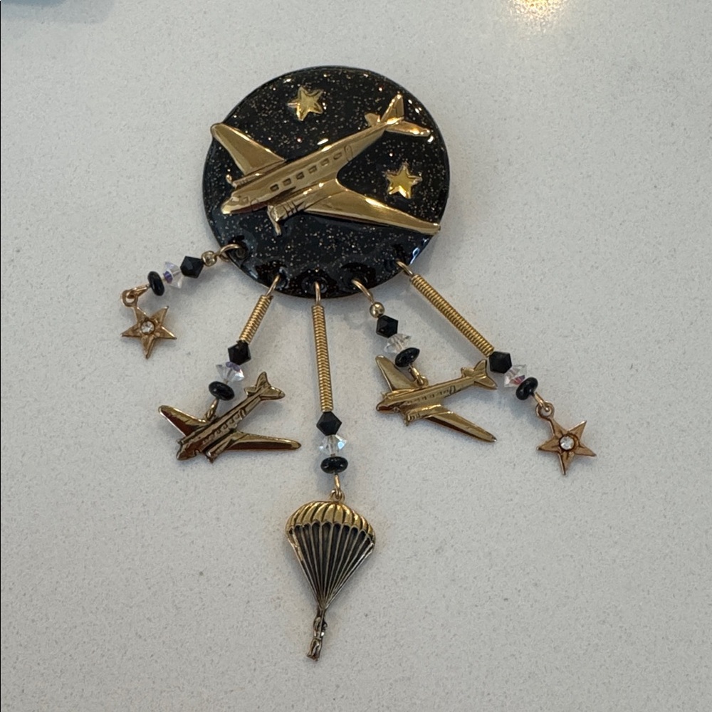 Moulin Rouge travel theme brooch.